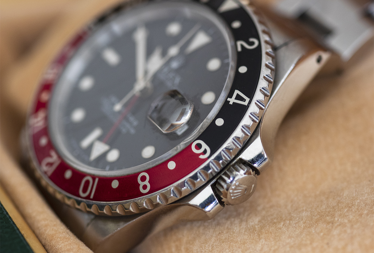Closeup Rolex GMT Master 2, nicknamed Coke, red and black steel men's wristwatch